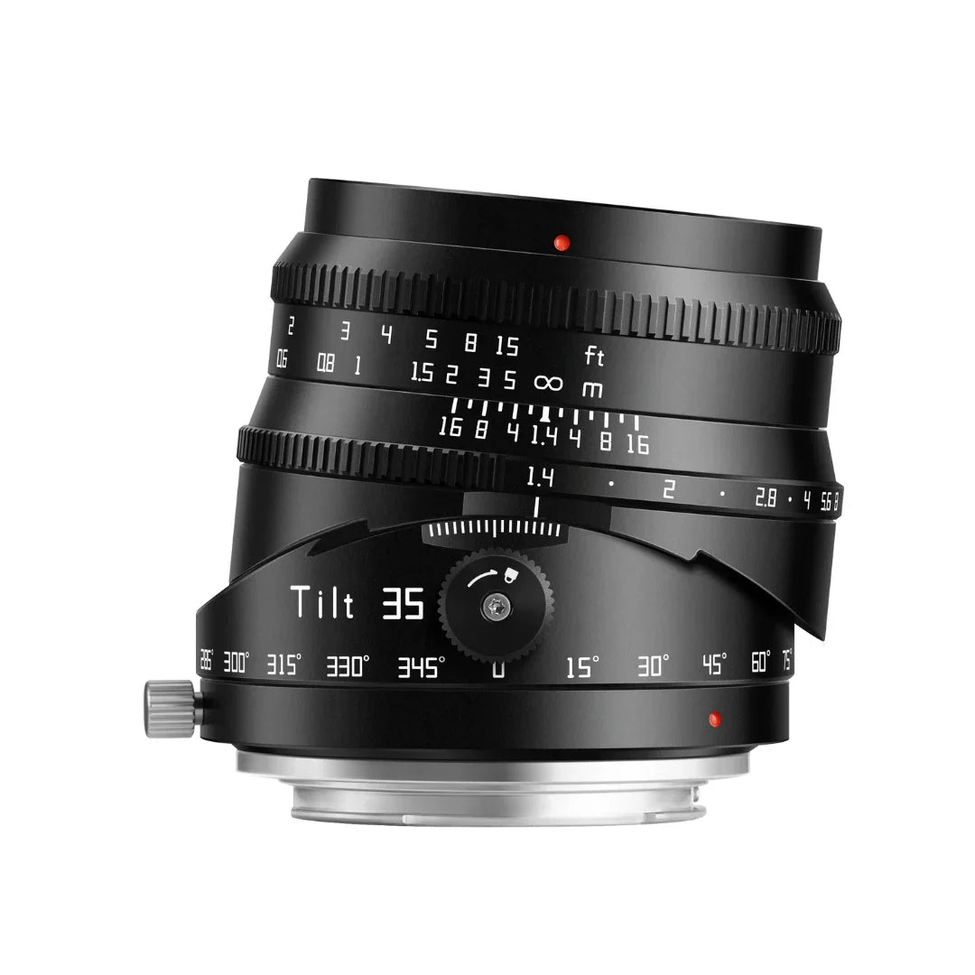 Black camera lens with tilt function, marked with focus and aperture settings, isolated