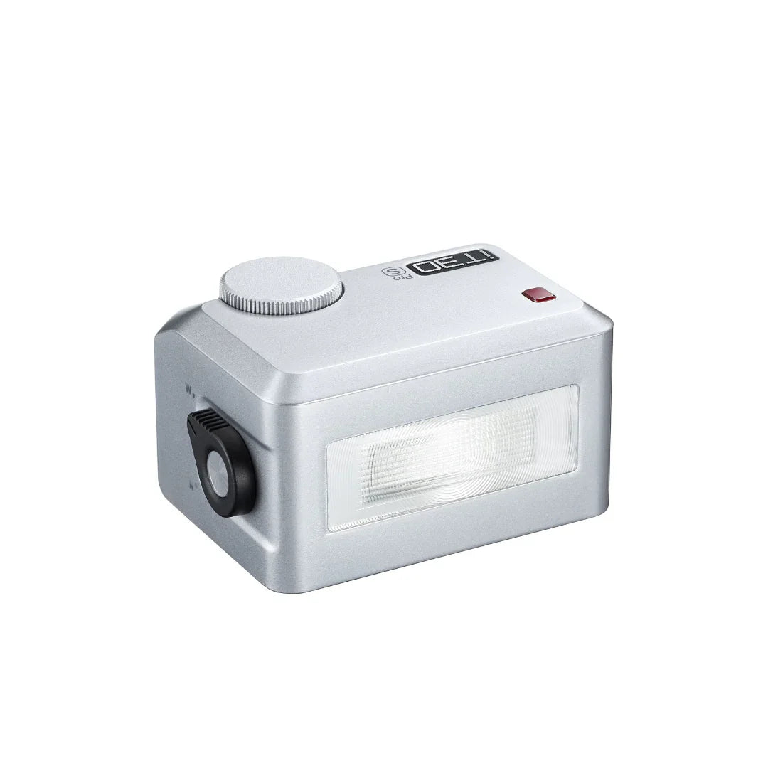 Silver ITFO Pro S camera flash unit with red button and adjustable dial on white background