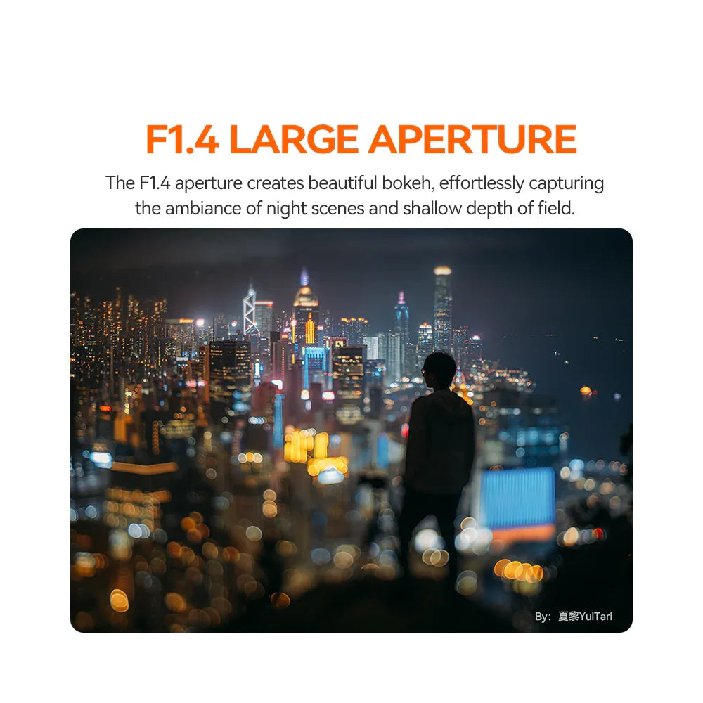 Silhouette of person with camera overlooking city skyline at night with bokeh effect, showcasing F1.4 aperture